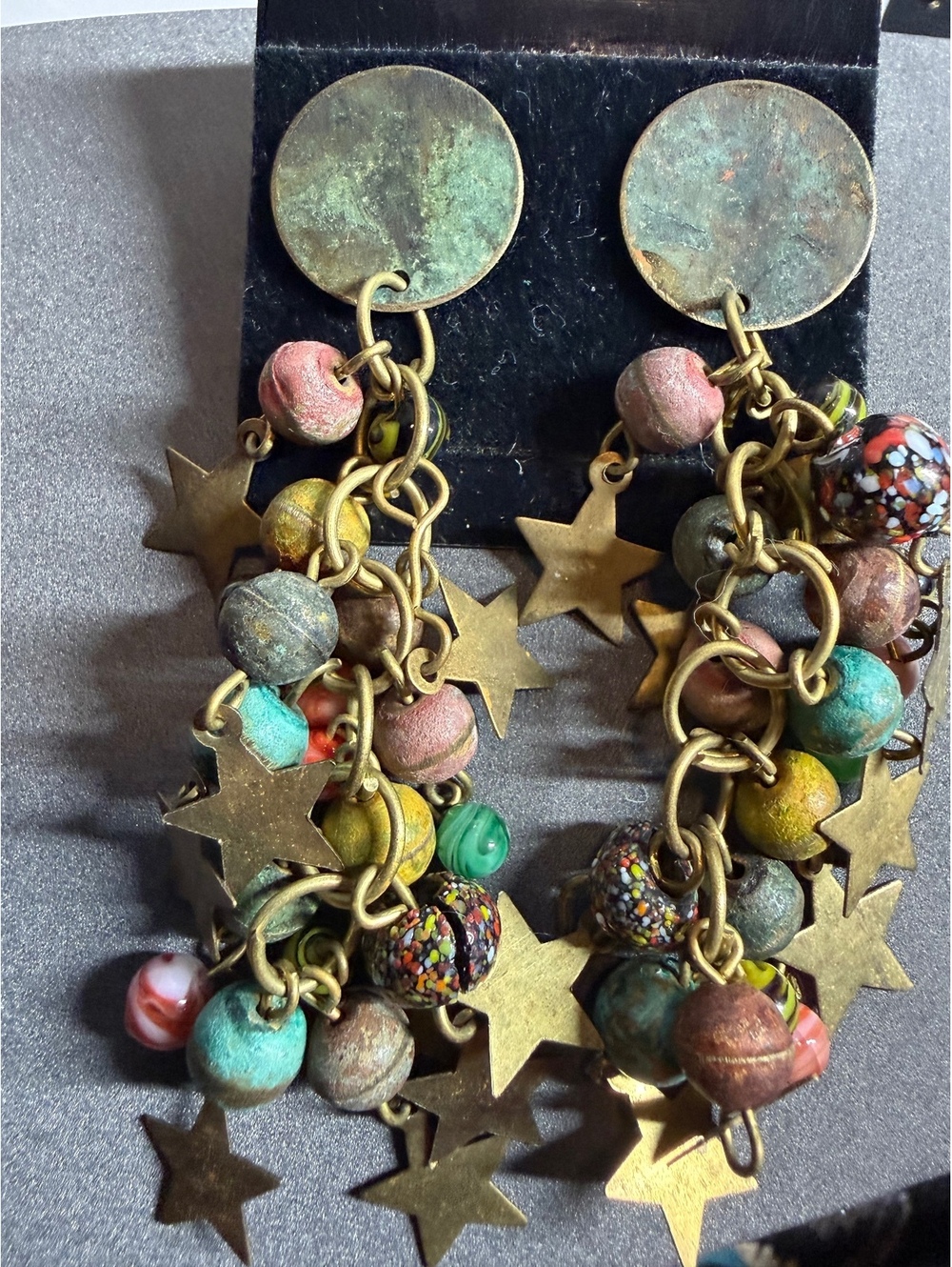 Brass tone star and bead dangle earrings